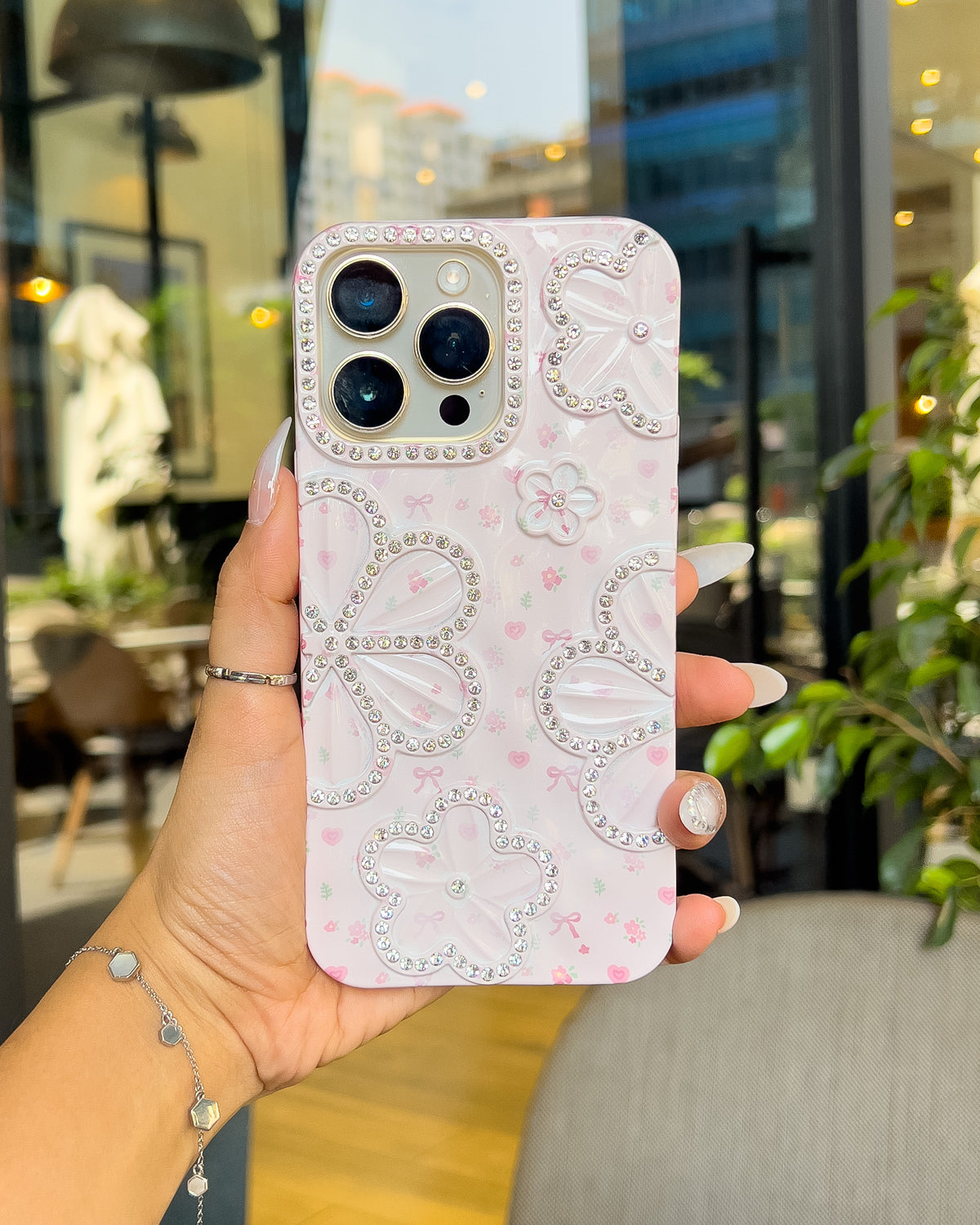 Blossom Crush pink pearlescent iPhone case with rhinestone flowers and pink bows โ TOKFO
