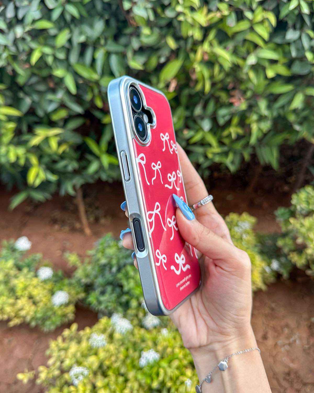 Bowtiful glossy wine-red iPhone phone case with pink bow print and chrome camera trim โ TOKFO