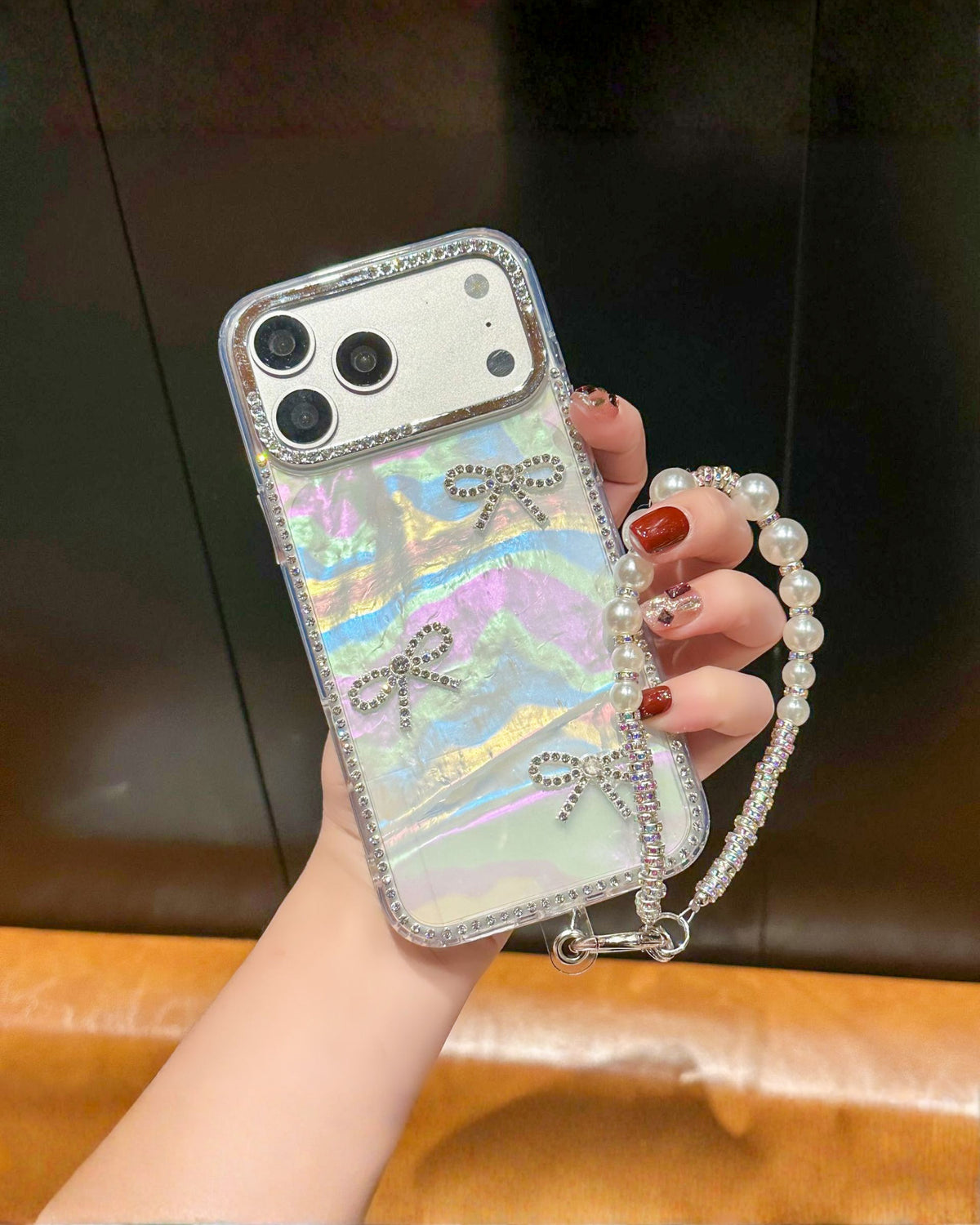 Disco Queen holographic aurora iPhone phone case with rhinestone border, rhinestone bows and pearl wrist chain โ TOKFO