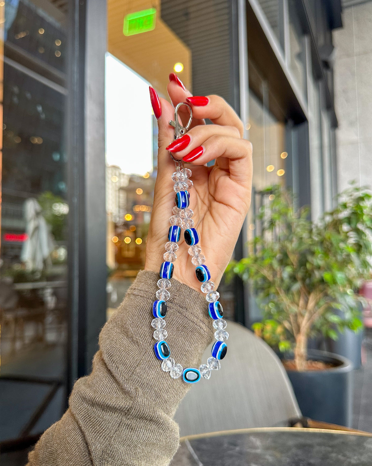 Evil Eye phone charm strap with blue and black evil eye beads, clear crystal beads and silver carabiner clasp – TOKFO