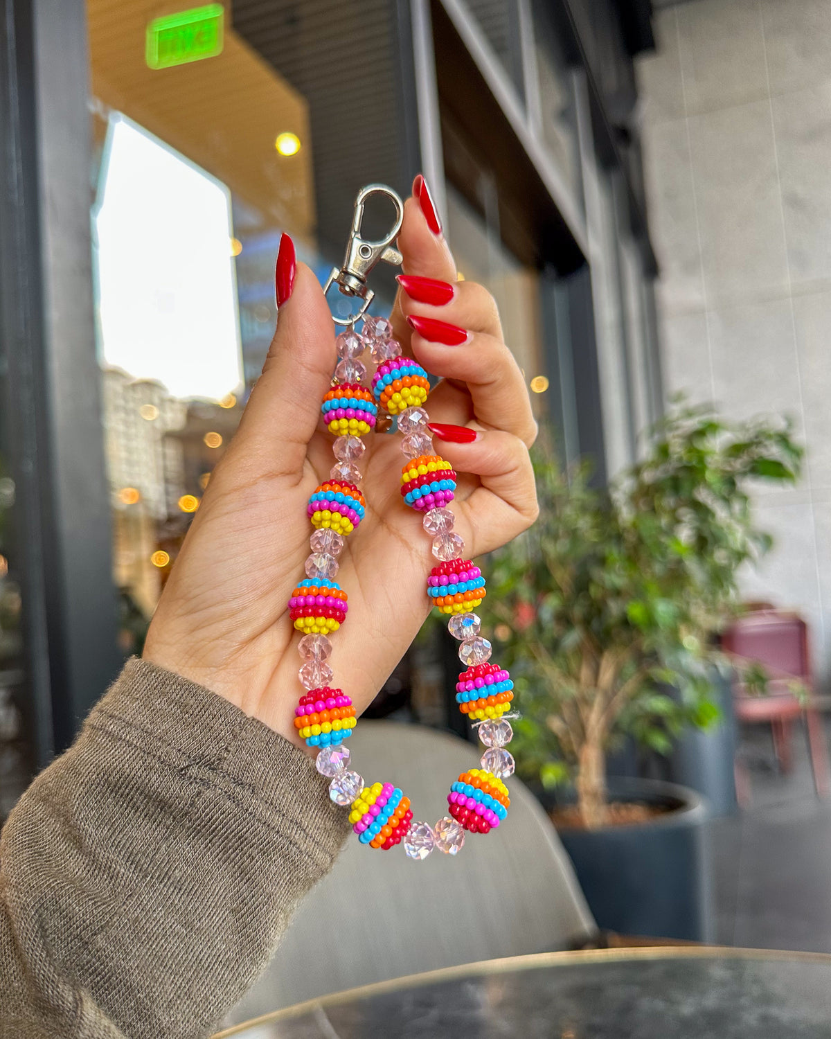 Fiesta phone charm strap with multicolour striped beads, pink crystal accents and silver carabiner clasp – TOKFO