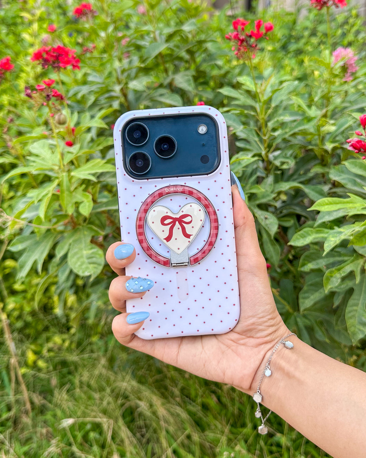 Back of the TOKFO Polka Dot Bow Stand phone case with the heart bow kickstand attached